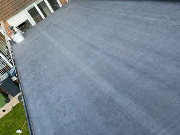 New EPDM flat roof installation on garage extension in Washington by local roofing contractors