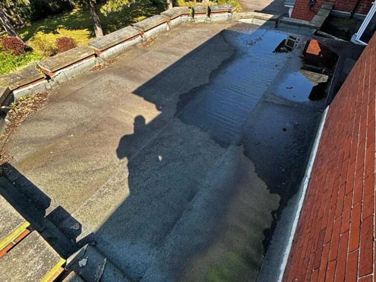 Damaged flat roof before repairs in Westoe