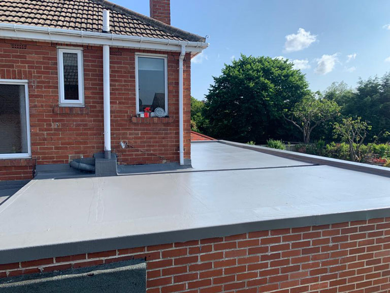 before and after photo of a liquid roof Washington