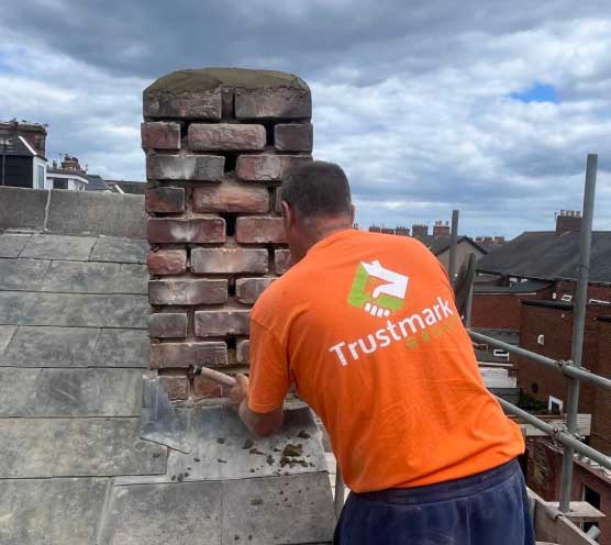 Chimney repointing work restoring damaged mortar joints